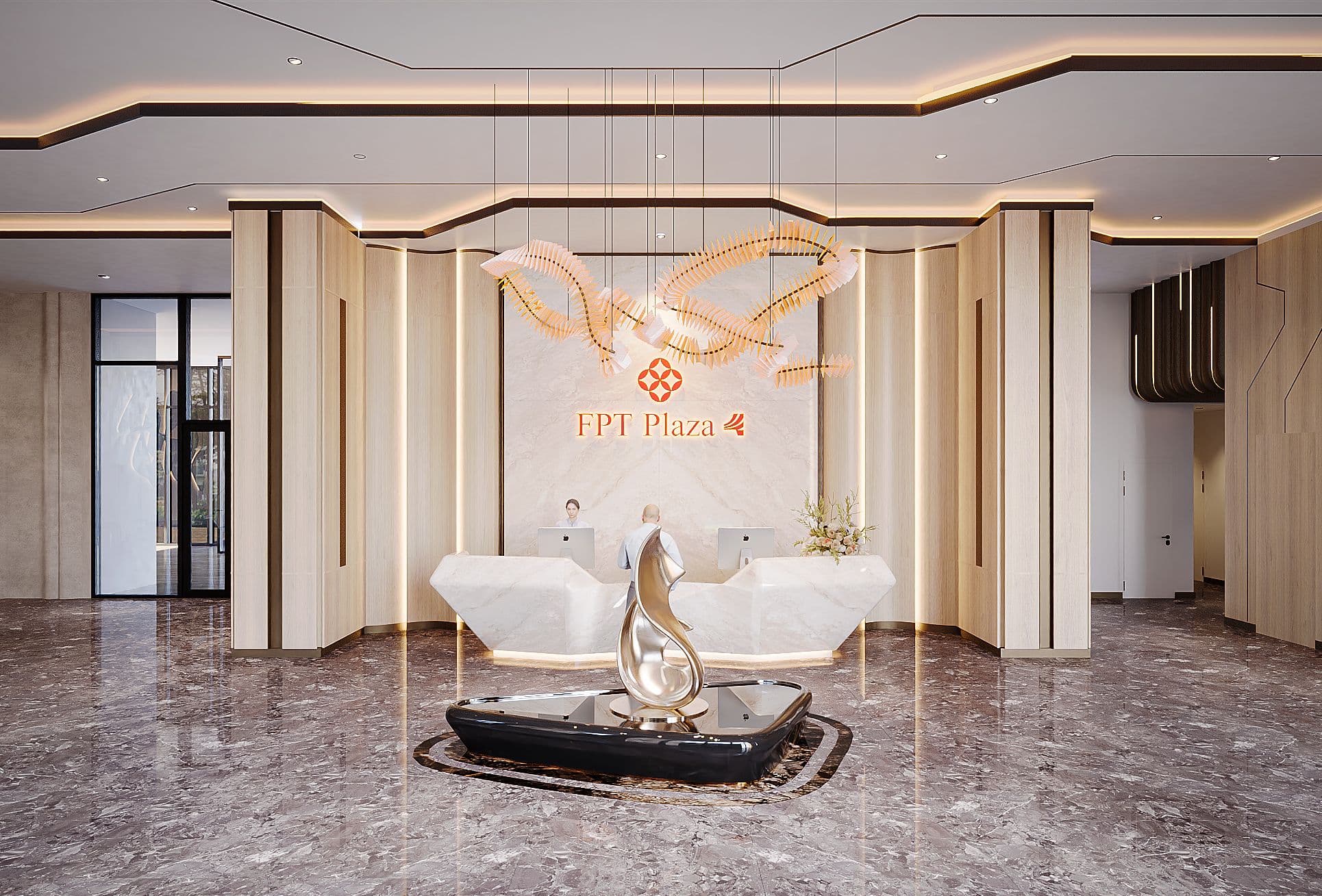 Modern lobby of FPI Plaza 4 featuring elegant decor, marble flooring, and a stylish reception desk with unique artwork.