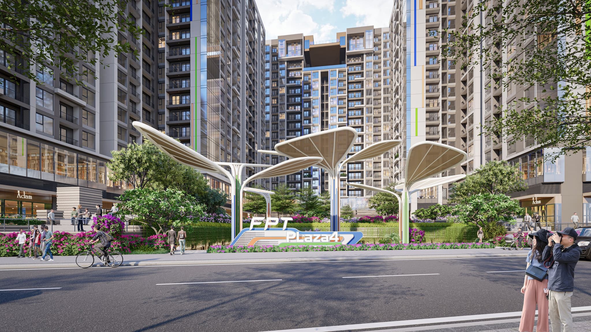 Modern urban plaza with green landscaping, a central logo for FPT Plaza, and contemporary high-rise buildings.