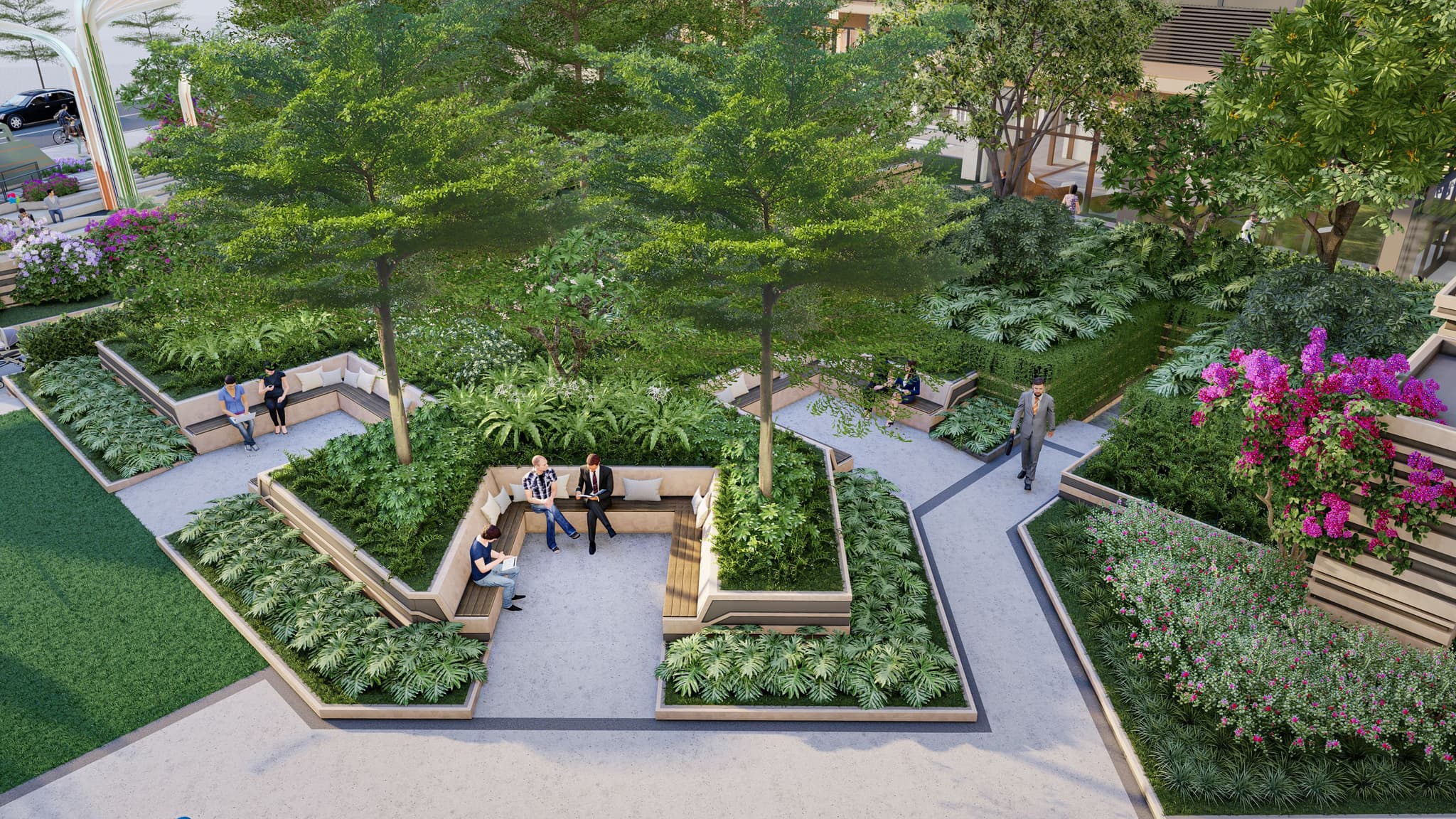 Aerial view of a landscaped garden featuring seating areas surrounded by lush greenery and blooming flowers.