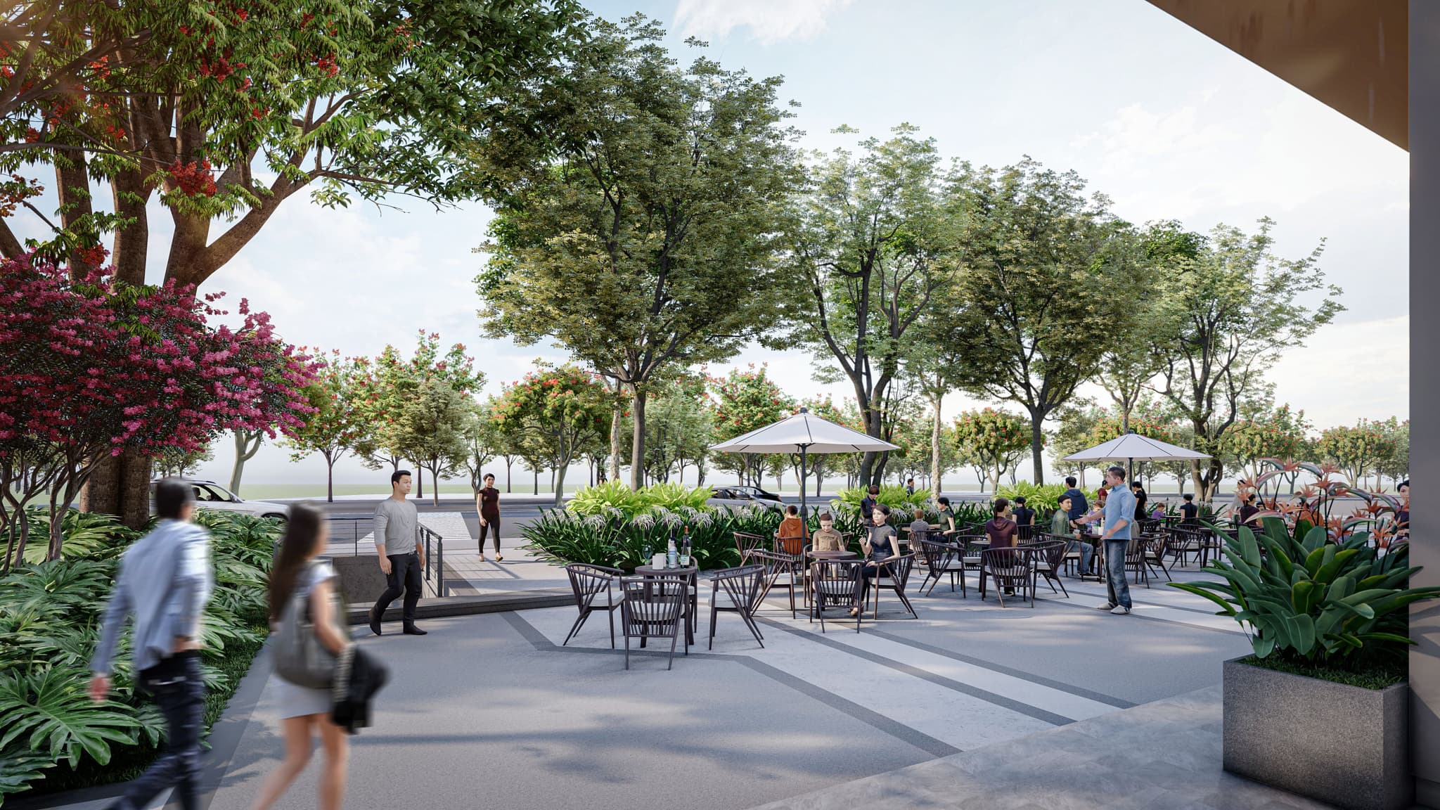 Lively outdoor café scene with shaded seating, greenery, and pedestrians enjoying a sunny day.