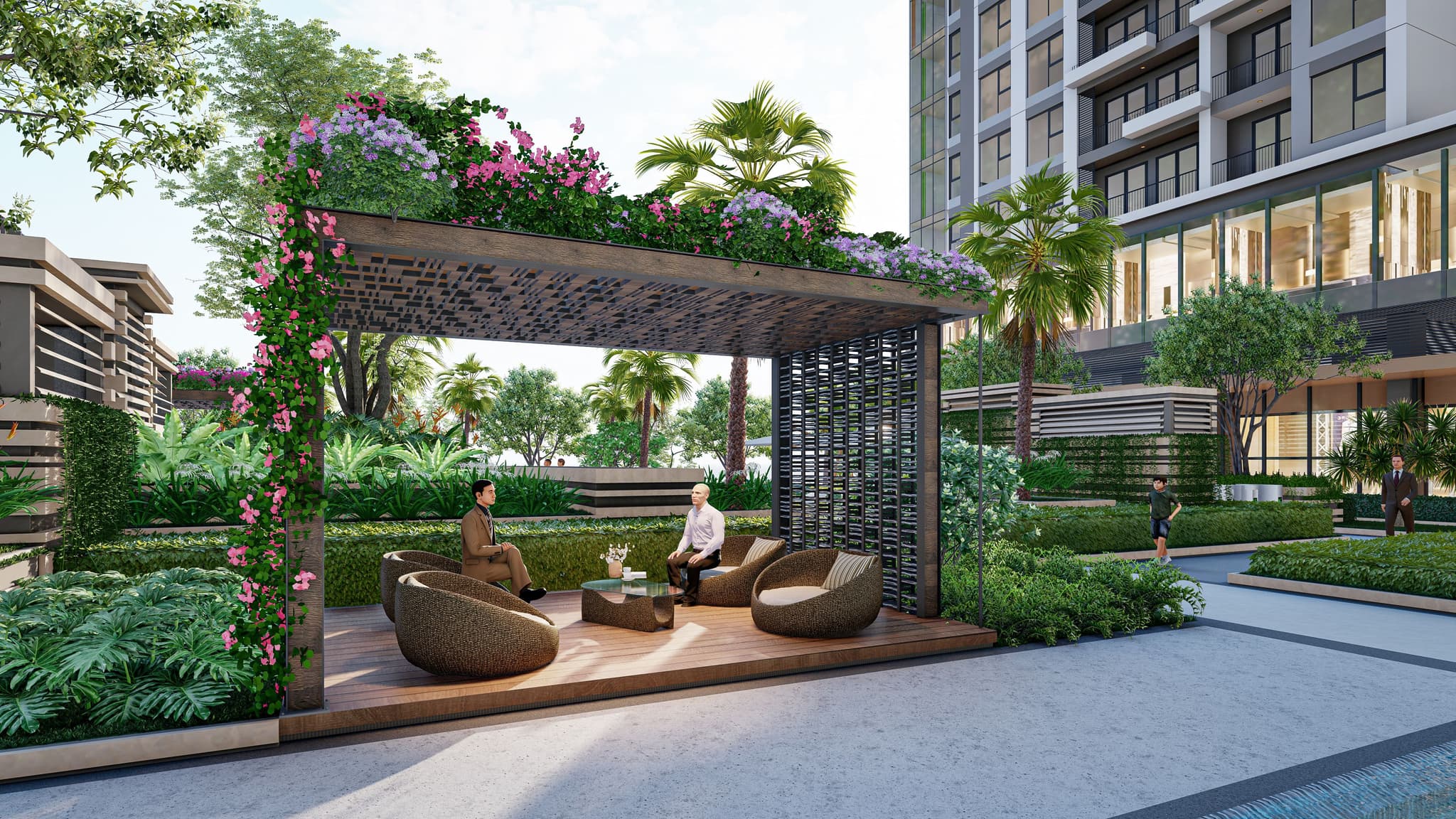Modern outdoor seating area with lush greenery and floral decor, perfect for relaxation in a landscaped environment.